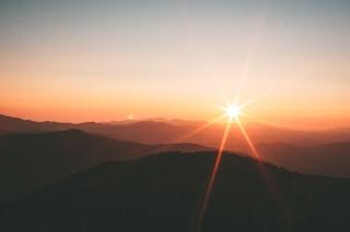landscape of sunrise over large hills