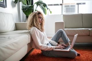 Woman typing on her laptop
