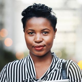 a woman with a slight smile standing facing the camera