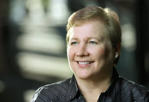 white woman with short hair smiling