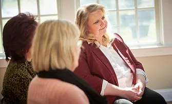three older women sitting together
