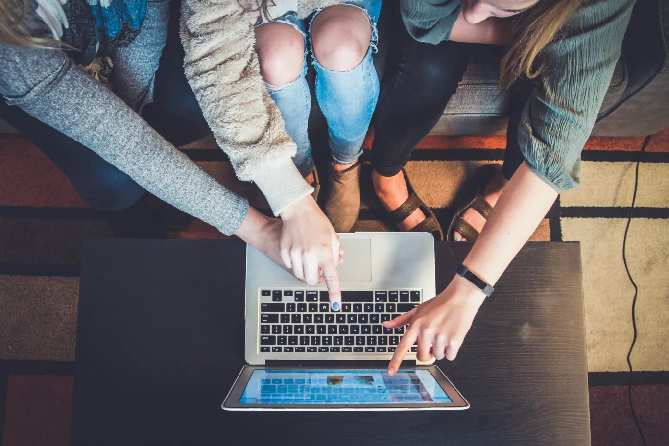 family signing onto laptop to help a loved one