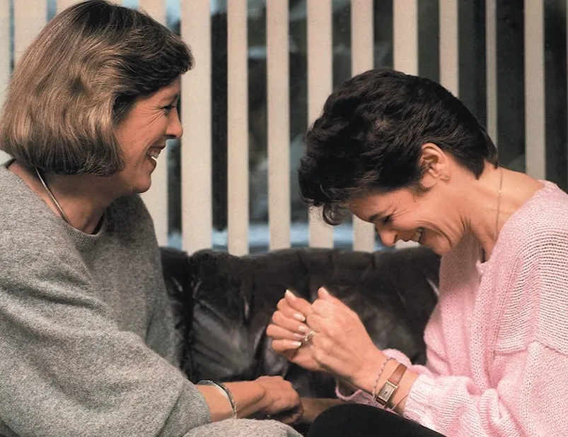 Gildna Radner laughs with a friend