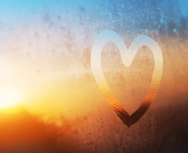 a hand-drawn heart on a window
