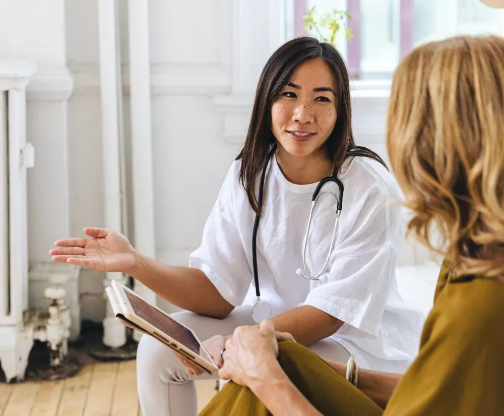 Two seated women talking