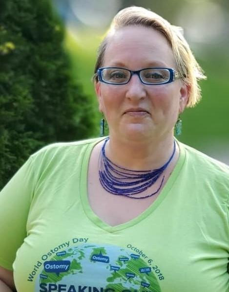 Liz Hiles wears a green T-shirt recognizing World Ostomy Day