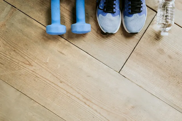 exercise weights, gym shoes, water bottle