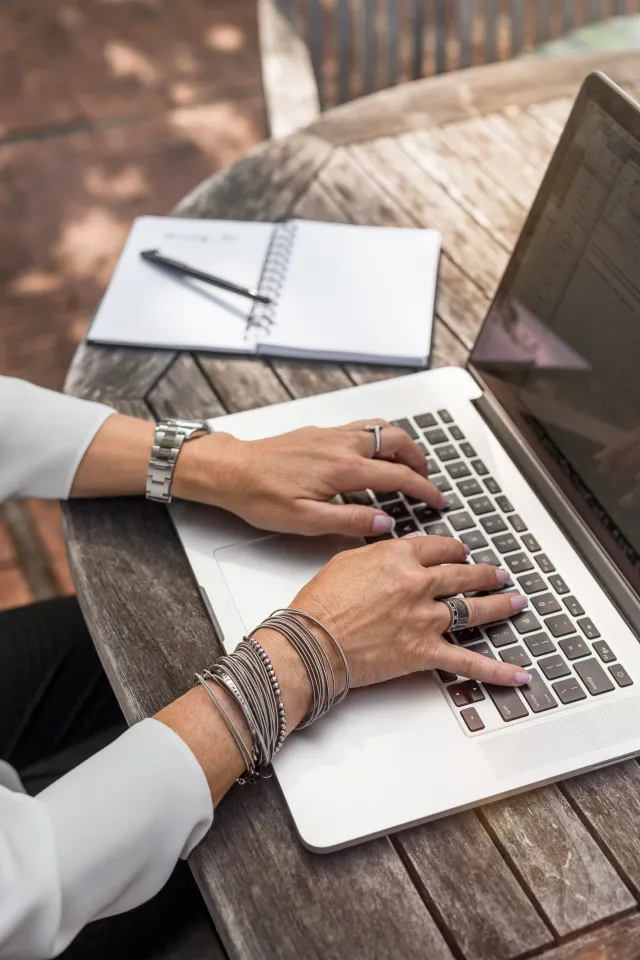 Woman typing on laptop