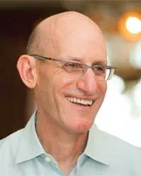Rob Tufel smiles off into the distance.