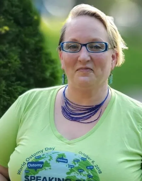Liz Hiles wears a green T-shirt recognizing World Ostomy Day