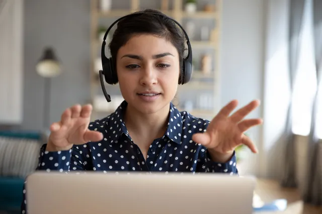 A helpline counselor wearing a headset