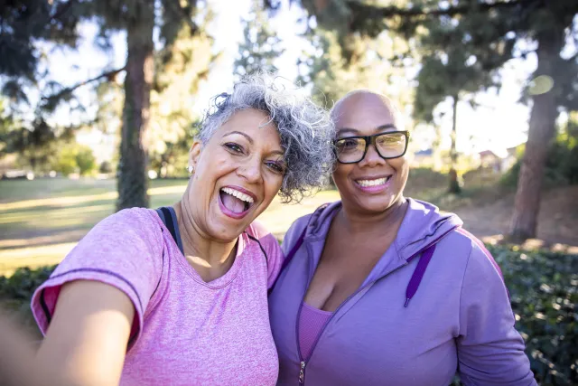 Two women smiling at each other