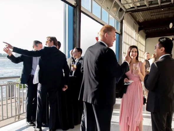 Guests mingle during CSC's Annual Celebration while enjoying a stunning view of the Hudson River
