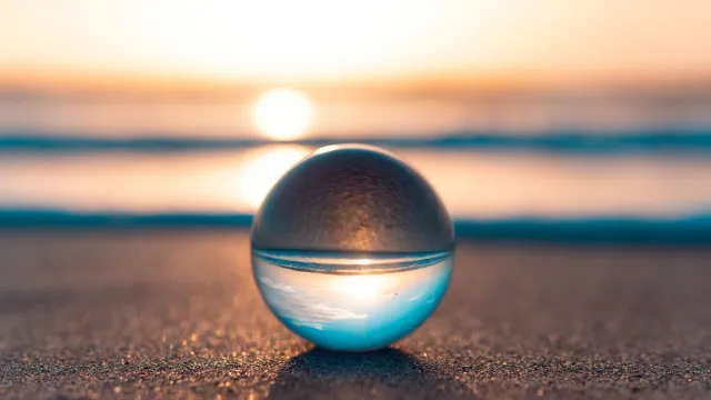 Glass photo ball on beach