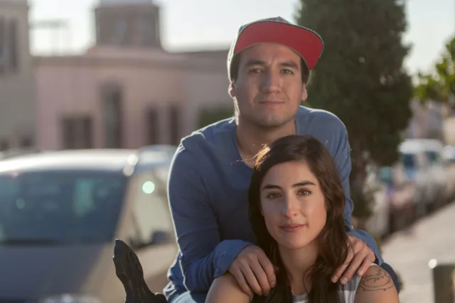 a man and a woman relaxing outside