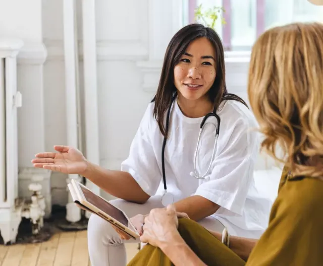 Two seated women talking