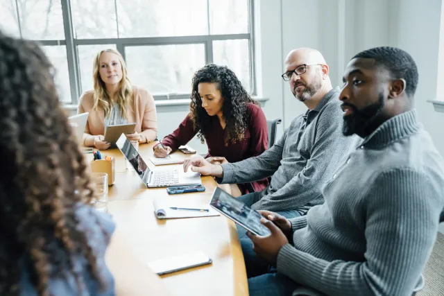 a group discussing around a table