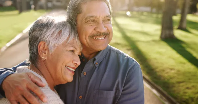Older couple embracing 
