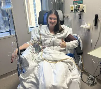 Abbie, smiling in a hospital room