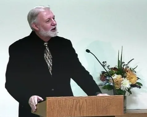 Jerry speaks at a podium