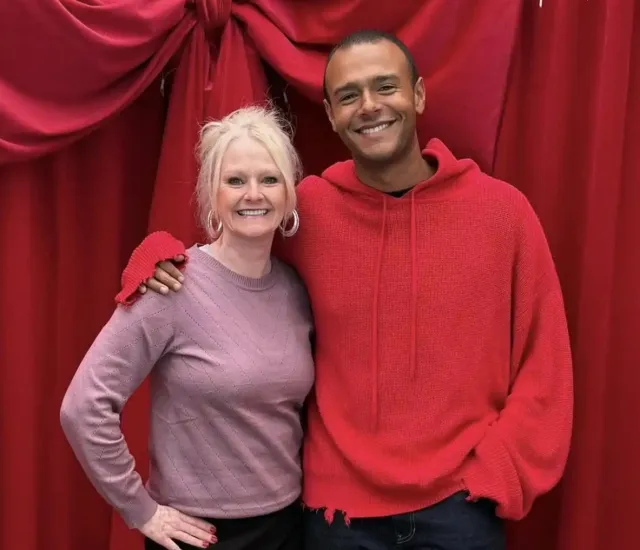 Lori and her son smile for a holiday photo