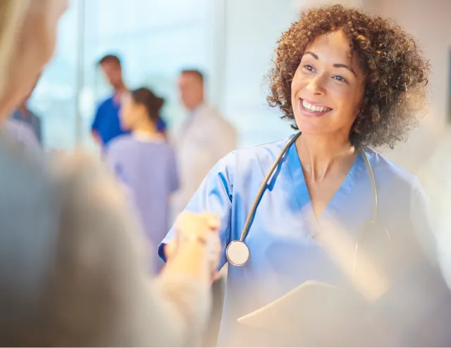 Nurse shaking hands
