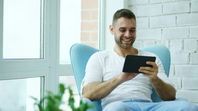 Man looking at tablet