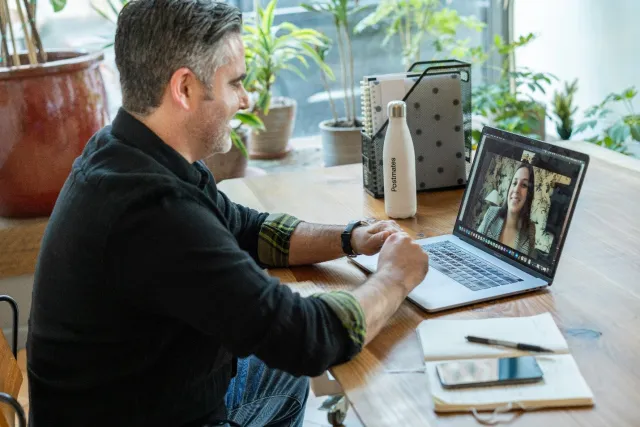 Man video chatting on computer
