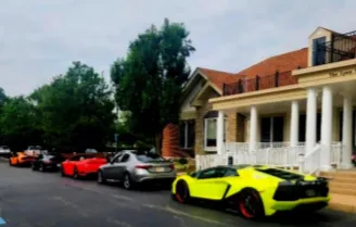 Sports cars lined up along a street curb.