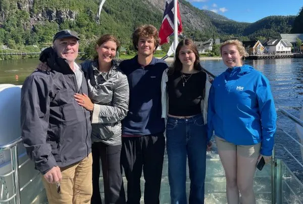 Meghan and her family enjoy a sunny outing on a sailboat