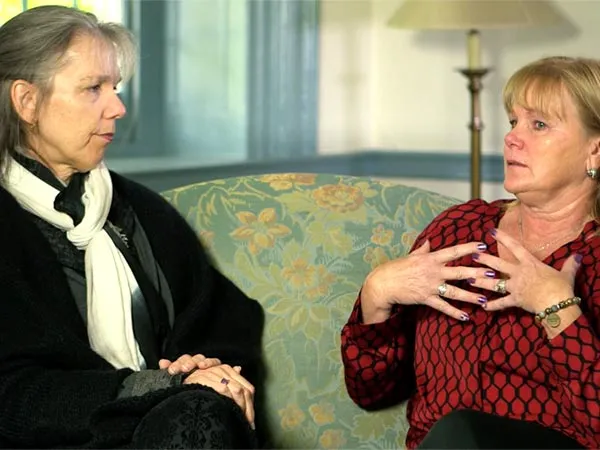 two white women discussing being caregivers