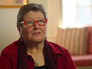 white woman talking about caregiving for a parent