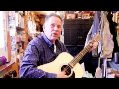 white man playing a guitar, four chords for cancer