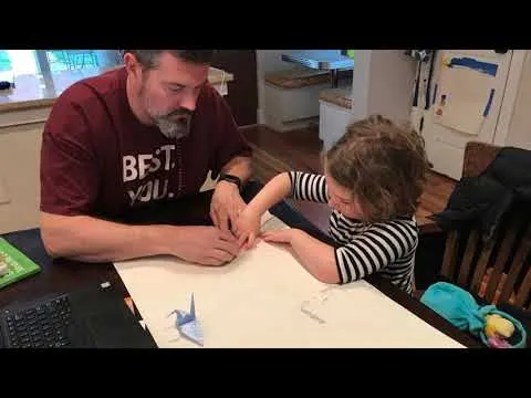 father and young daughter working together
