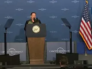 Kim speaking at Cancer Moonshot