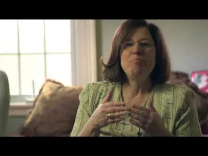white woman in green shirt talking about what you should know about implants