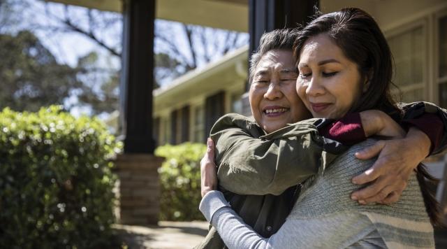 A mother and daughter embracing