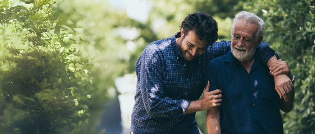 Man walking with elderly Father