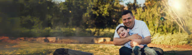 Man holding his child smiling 