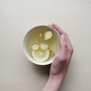 Hand holding a cup