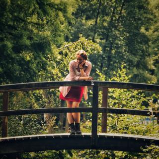 Fatigued girl on a bridge