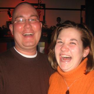 Justin and Kelly laugh together during an evening out with friends in 2008