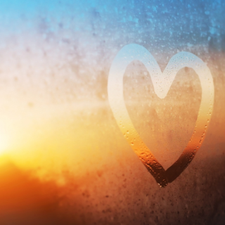 a hand-drawn heart on a window