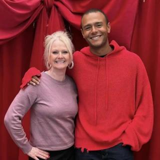Lori and her son smile for a holiday photo