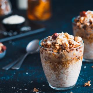 Two glass cups filled with plant-based overnight oats