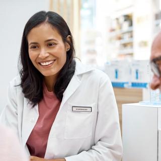 A middle aged female doctor and two patients
