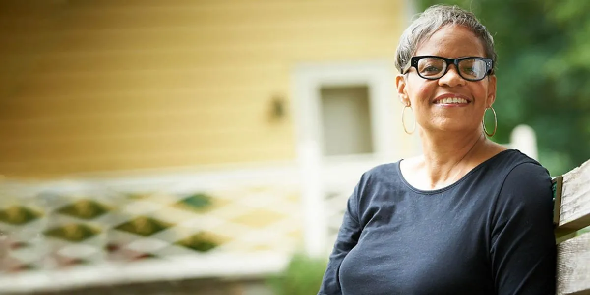 older black woman smiling outside