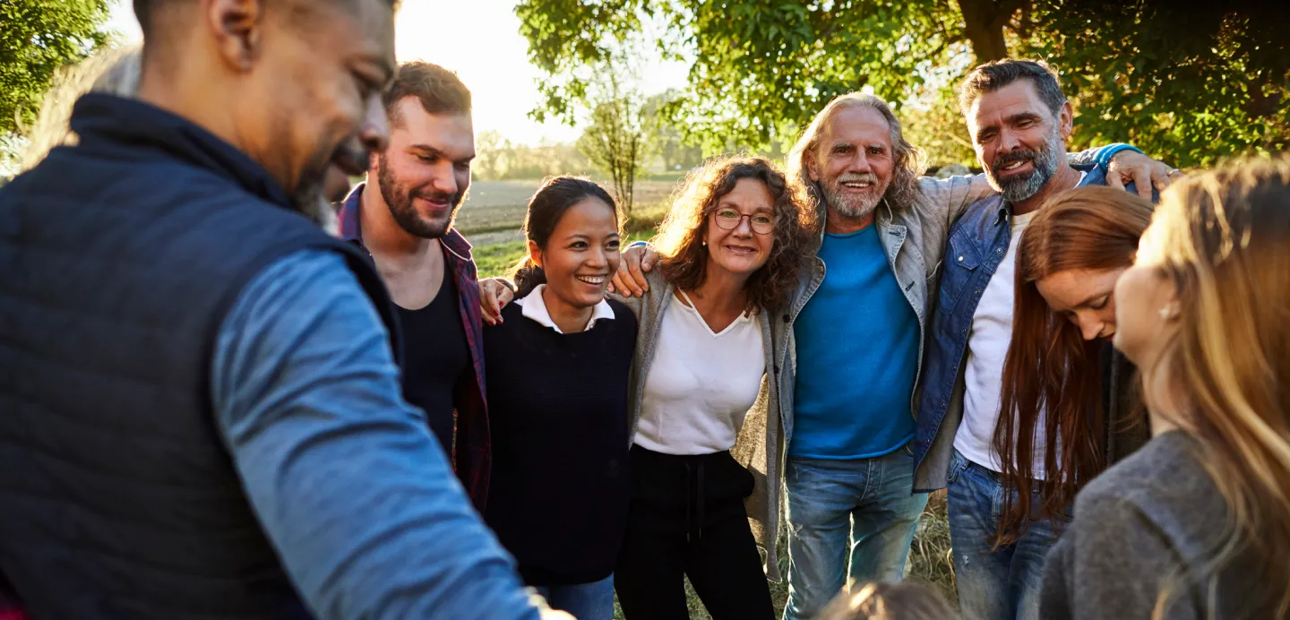 A group of people standing in a circle