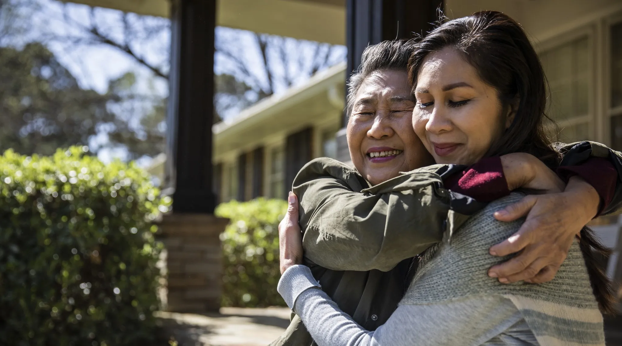 A mother and daughter embracing