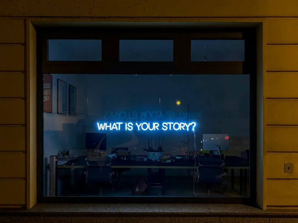 What Is Your Story? display LED lights in office window